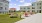 Outdoor courtyard with picnic areas, grilling stations, and shaded seating areas